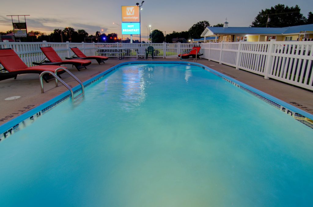 Seasonal outdoor pool at Westbridge Inn & Suites in Clinton, MO