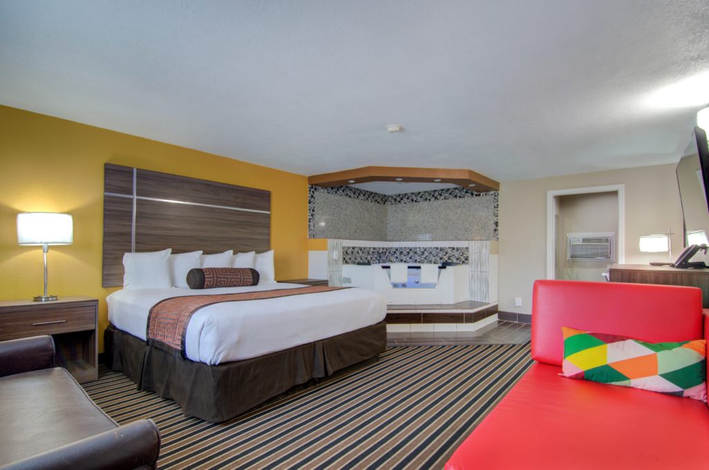 Three-Bedroom Family Suite with three full-size beds at Westbridge Inn & Suites